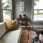 Cozy one-bedroom apartment interior at 60 Emerson St, Portland with hardwood floors, kitchen, and large windows