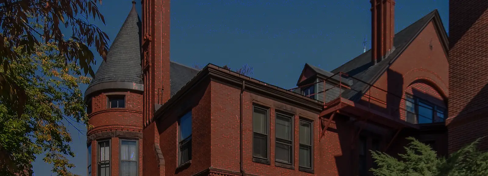 Exterior view of historic red brick apartment buildings in Portland, Maine